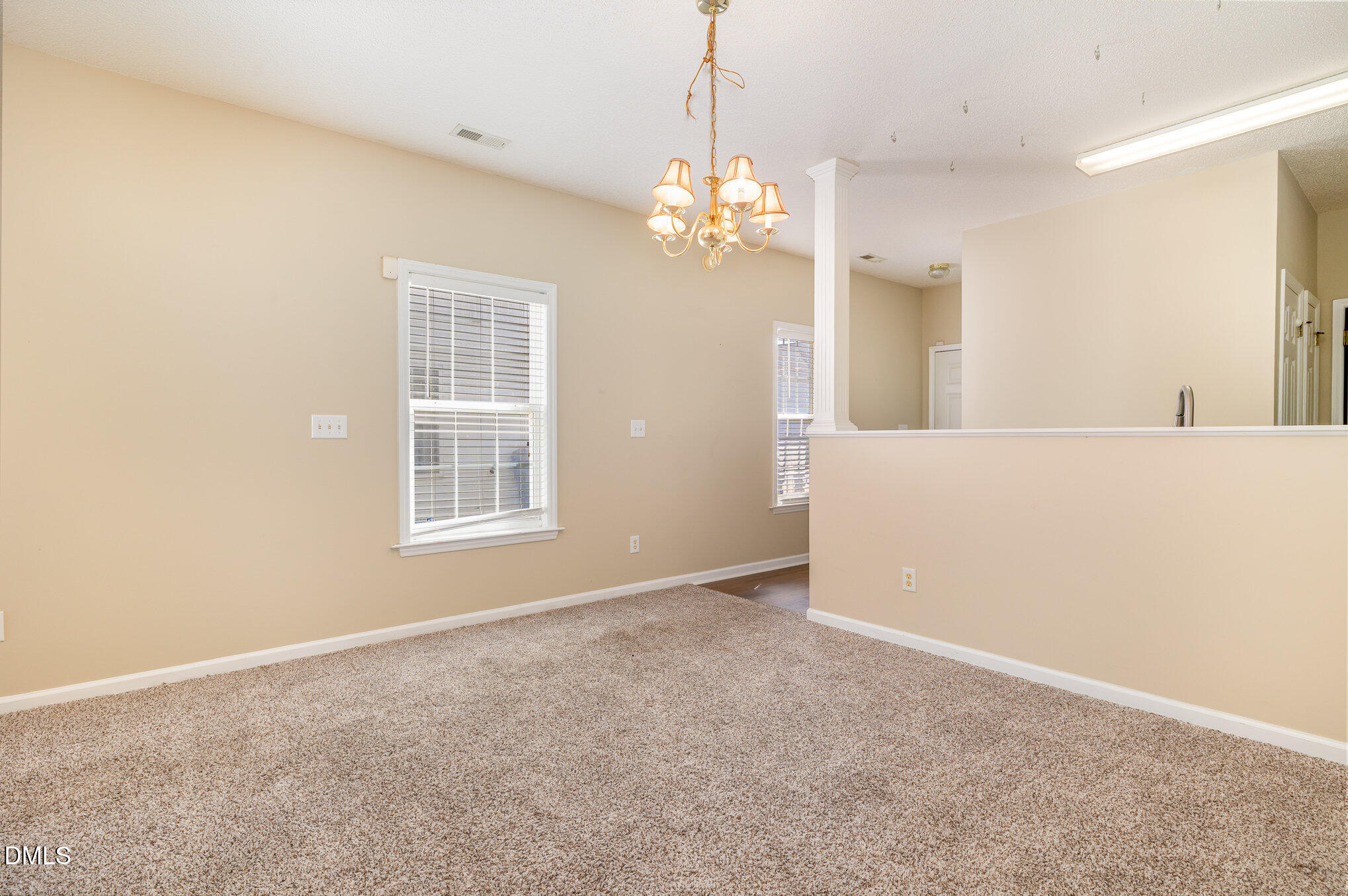 2116 Metacomet Way Raleigh, NC 27604 - Photo 6 of 24 a view of an empty room with chandelier