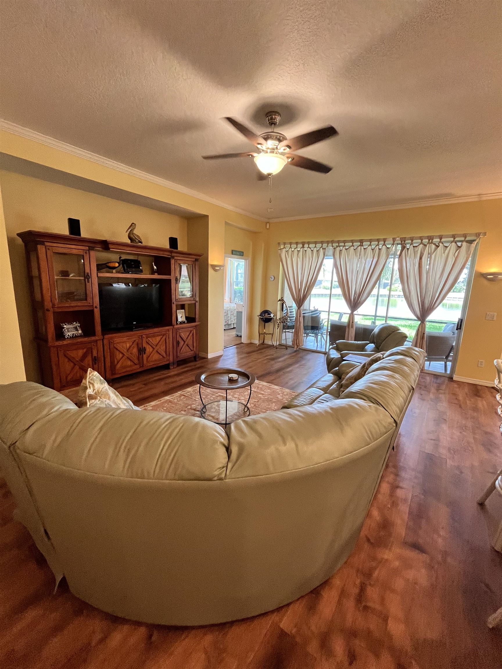 613 Casa Fuerta Lane St. Augustine, FL 32080 - Photo 11 of 23 a room with furniture and flat screen tv