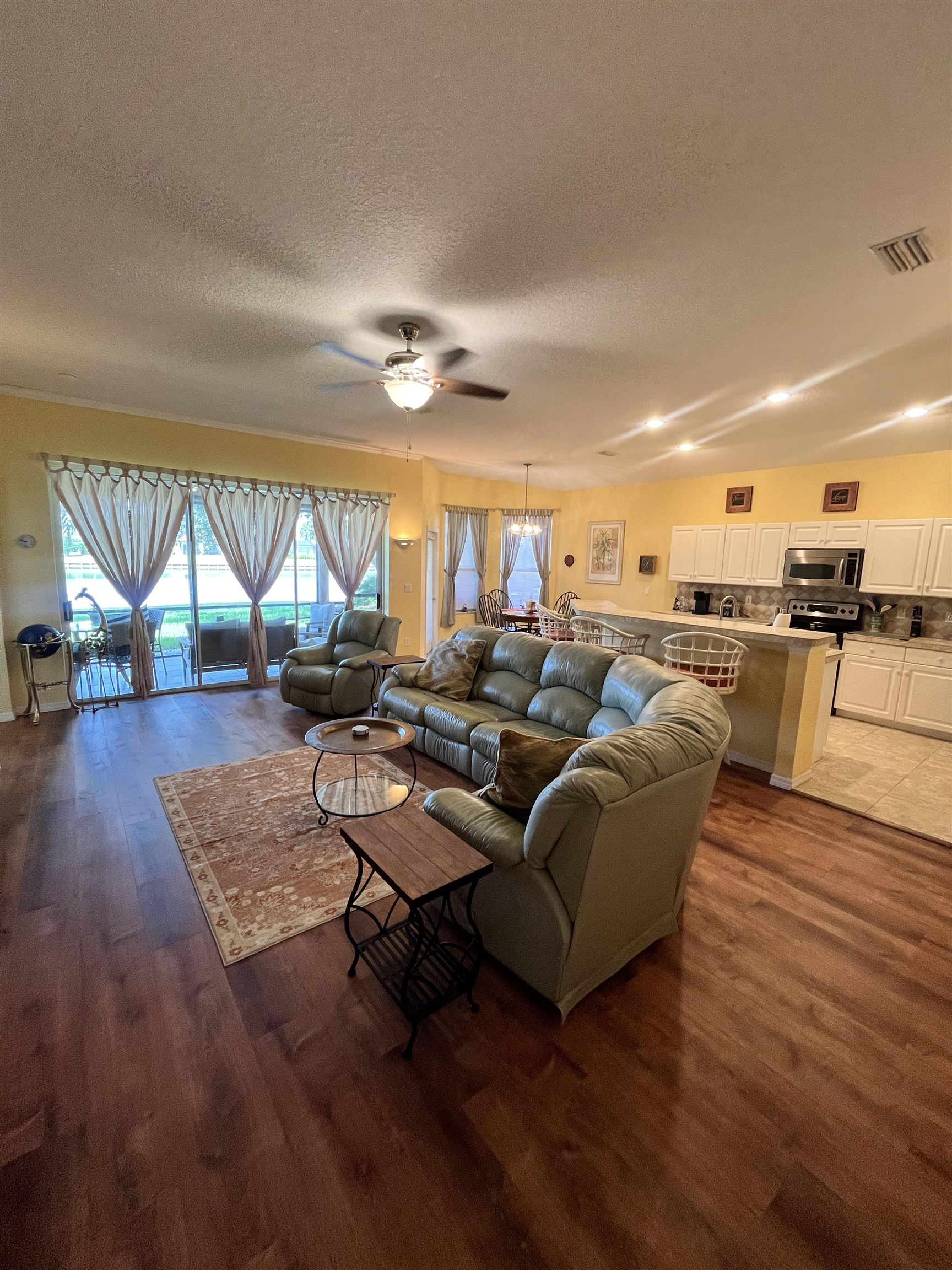613 Casa Fuerta Lane St. Augustine, FL 32080 - Photo 4 of 23 a living room with furniture and a large window