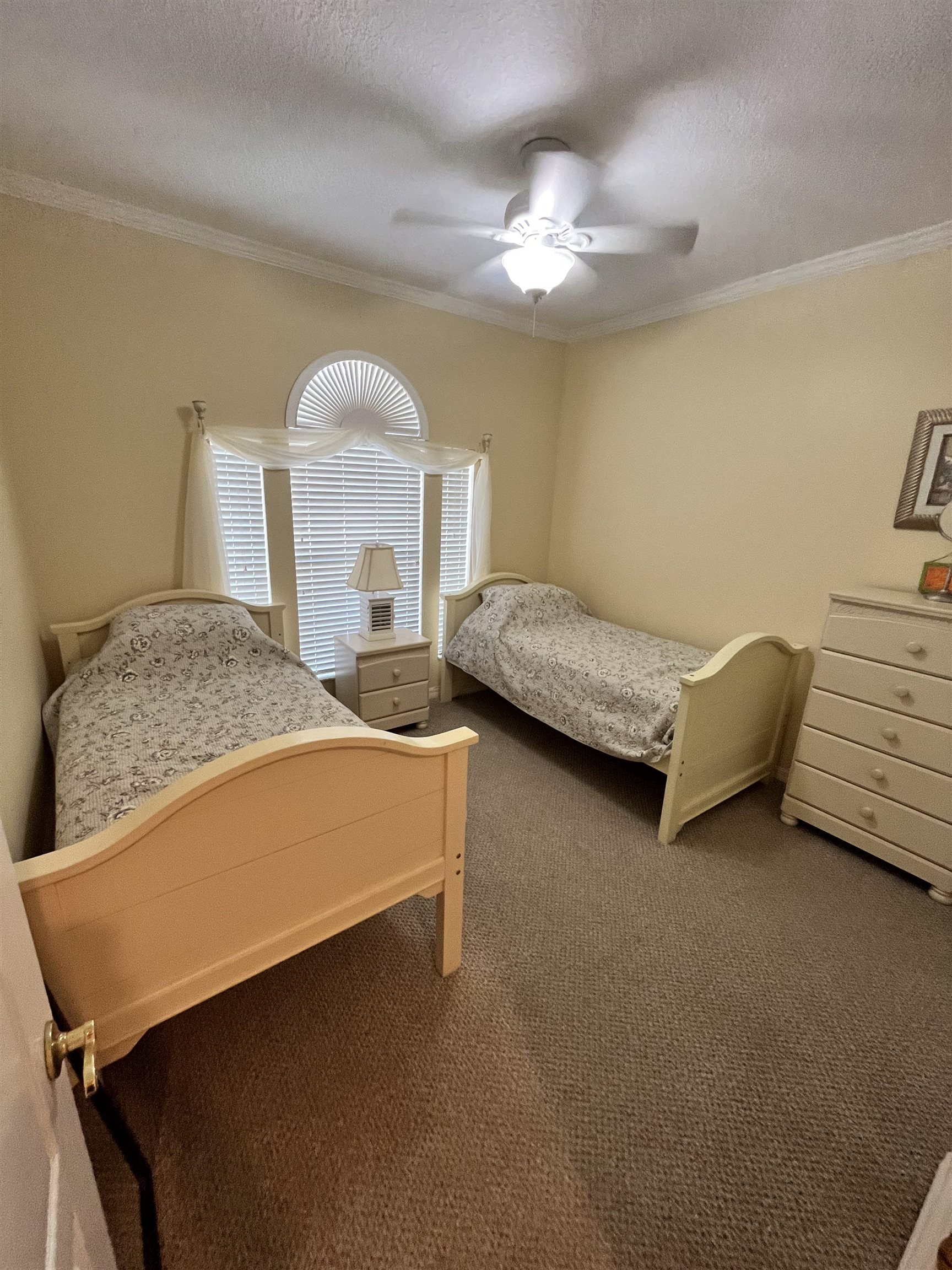 613 Casa Fuerta Lane St. Augustine, FL 32080 - Photo 5 of 23 a bedroom with two beds and chandelier