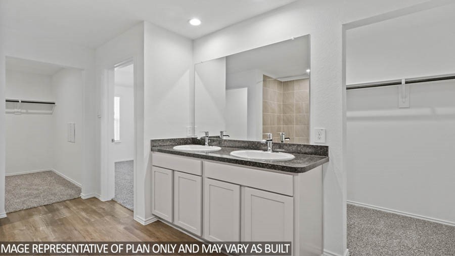 14380 Oceanblue Way Splendora, TX 77372 - Photo 9 of 24 a bathroom with a sink and a mirror