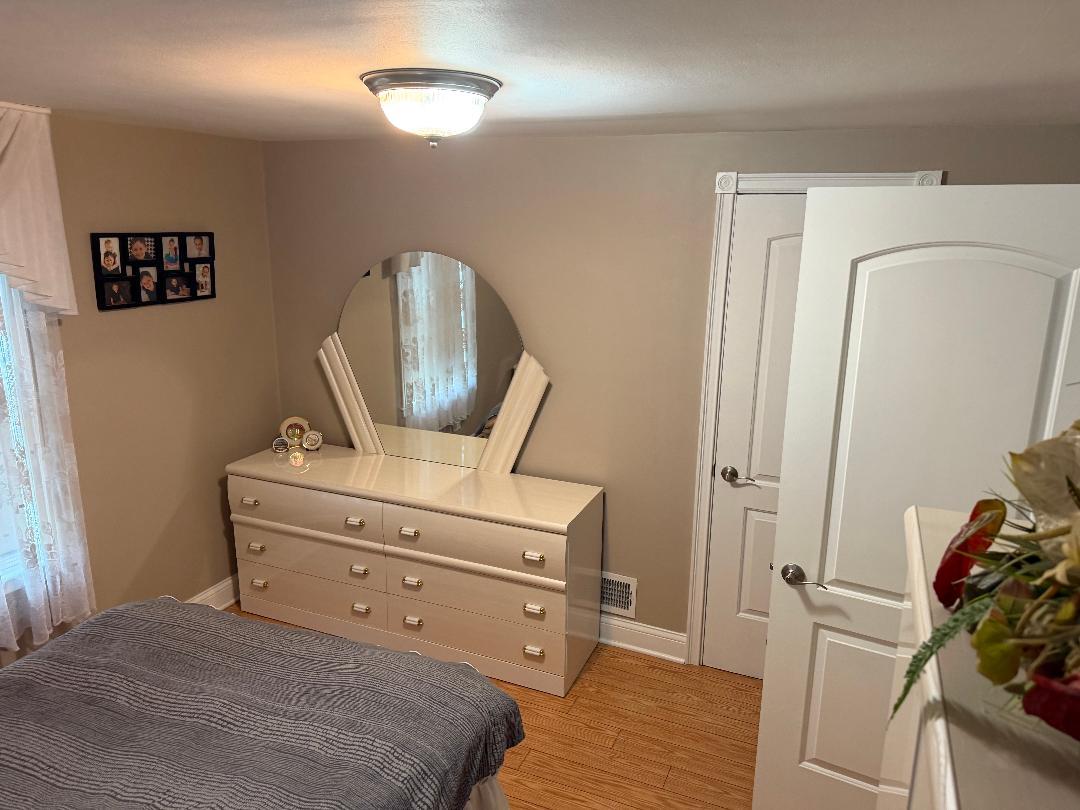 272 West Irving Park Road Wood Dale, IL 60191 - Photo 7 of 12 a room with a bed and furniture