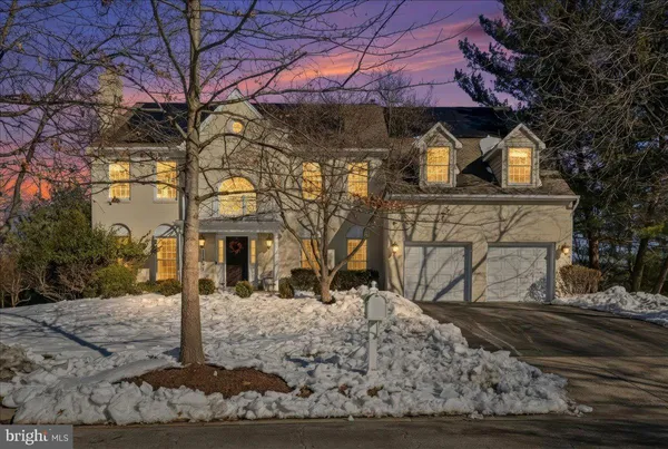 a view of a white house with a snow