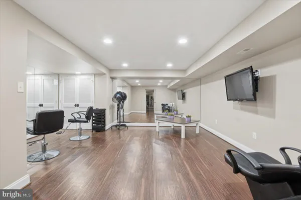 a spacious bedroom with a bed and a couch