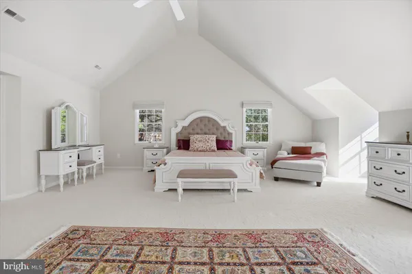 a bedroom with bed and a window