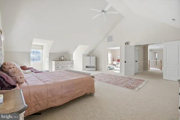 a bedroom with a bed and a cabinets