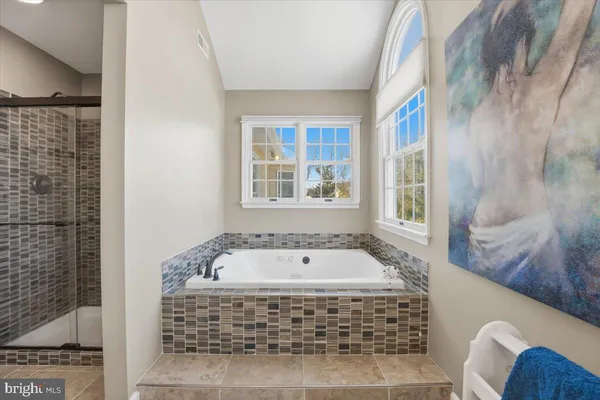 a bedroom with a bed and a dresser in it