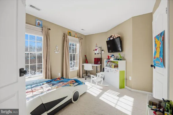 a spacious bathroom with a sink and a mirror