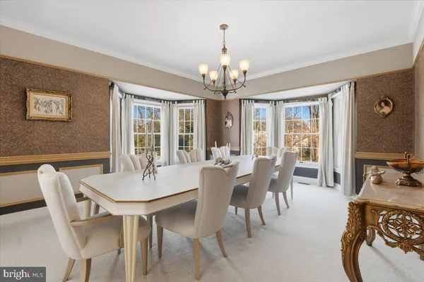 a kitchen with stainless steel appliances granite countertop a sink a stove and a wooden cabinets