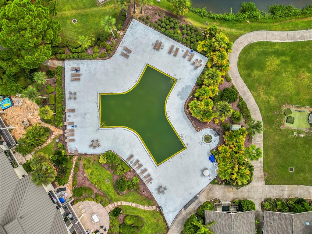 4947 Mill Pond Road, Unit 3103 & 3105 Wesley Chapel, FL 33543 - Photo 13 of 46 an aerial view of a swimming pool
