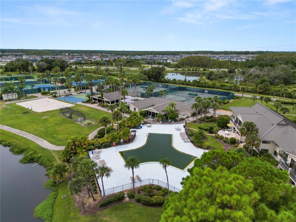 4947 Mill Pond Road, Unit 3103 & 3105 Wesley Chapel, FL 33543 - Photo 18 of 46 an aerial view of a house with a lake view