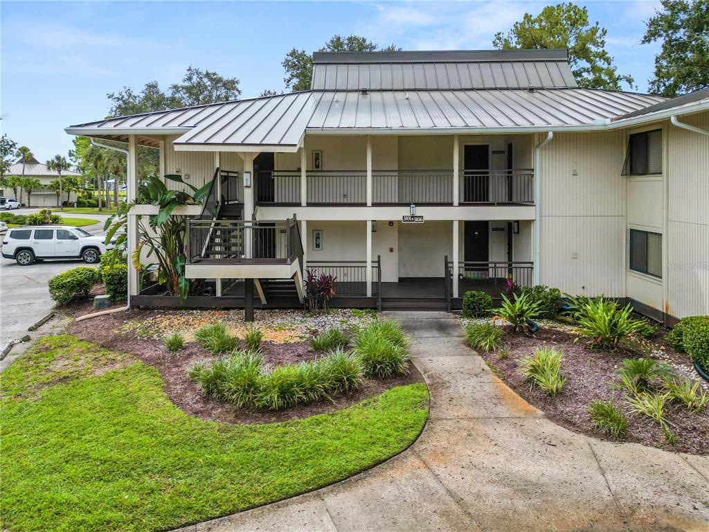4947 Mill Pond Road, Unit 3103 & 3105 Wesley Chapel, FL 33543 - Photo 23 of 46 a view of a house with sitting area and garden