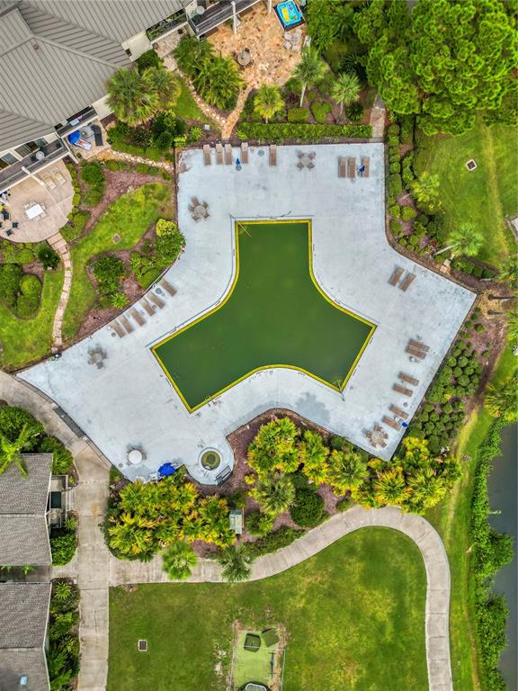 4947 Mill Pond Road, Unit 3103 & 3105 Wesley Chapel, FL 33543 - Photo 27 of 46 an aerial view of a swimming pool