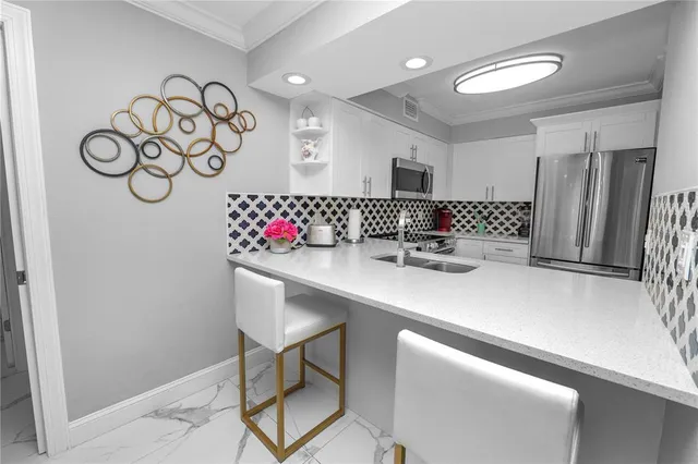 a kitchen with a table and chairs in it