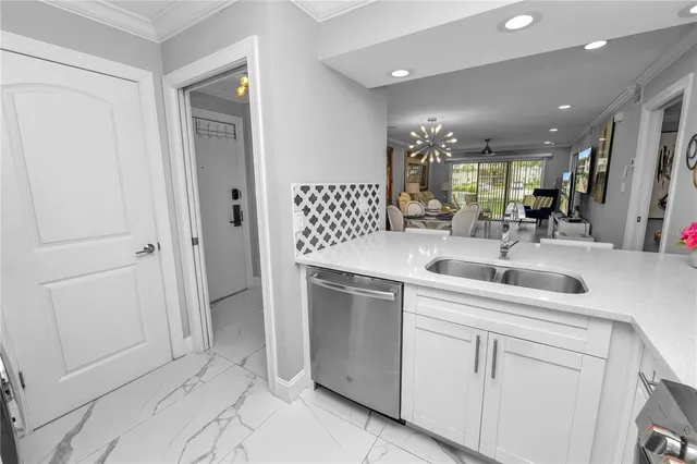 a kitchen with a sink and cabinets