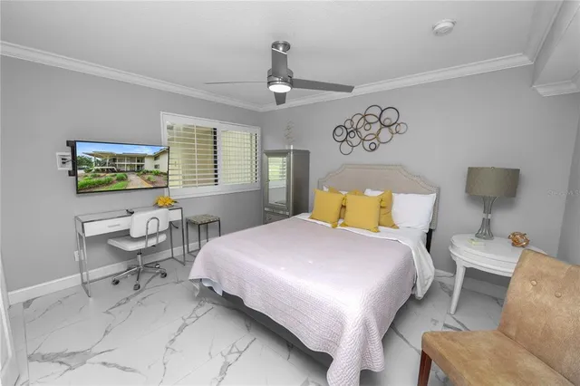 a bedroom with a bed couch and window