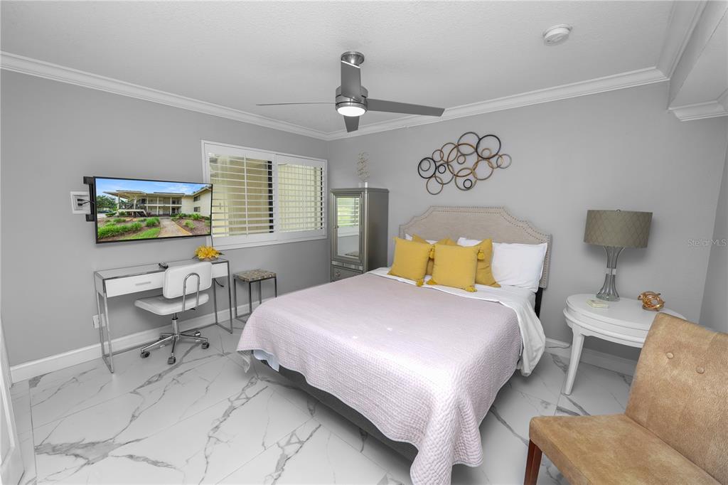 4947 Mill Pond Road, Unit 3103 & 3105 Wesley Chapel, FL 33543 - Photo 33 of 46 a bedroom with a bed couch and window