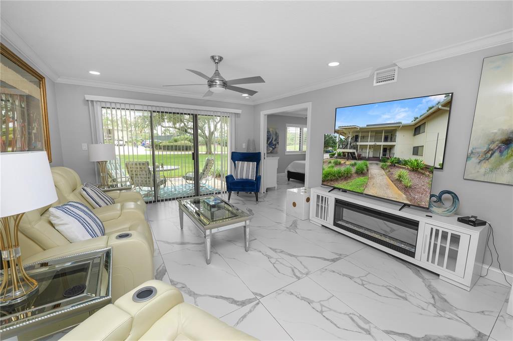 4947 Mill Pond Road, Unit 3103 & 3105 Wesley Chapel, FL 33543 - Photo 42 of 46 a living room with furniture and a large window