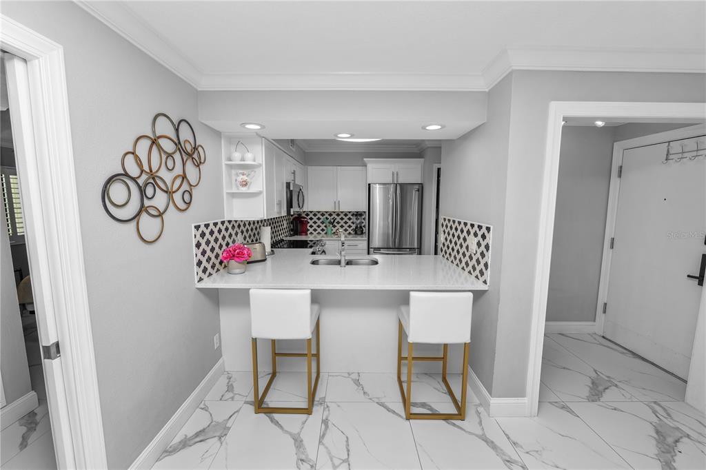 4947 Mill Pond Road, Unit 3103 & 3105 Wesley Chapel, FL 33543 - Photo 46 of 46 a view of a dining room with furniture