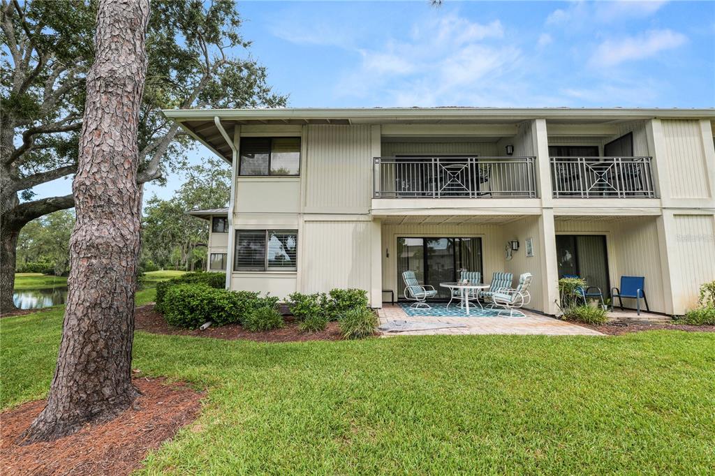 4947 Mill Pond Road, Unit 3103 & 3105 Wesley Chapel, FL 33543 - Photo 6 of 46 a front view of a house with garden