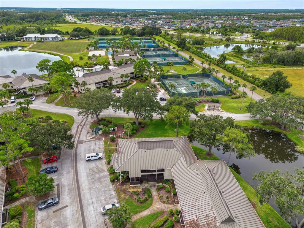4947 Mill Pond Road, Unit 3103 & 3105 Wesley Chapel, FL 33543 - Photo 9 of 46 an aerial view of residential houses with outdoor space