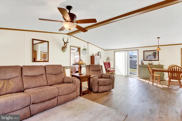 a bedroom with a bed a table and chair