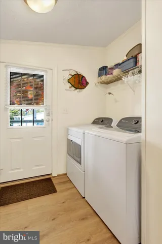 a view of a white house with a yard