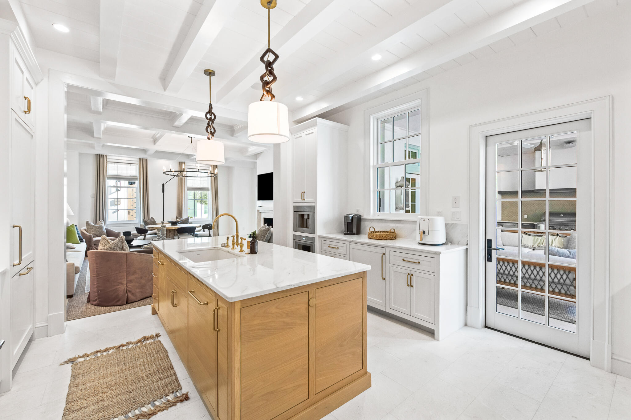 16 Smugglers Alley Inlet Beach, Unit BB6 Inlet Beach, FL 32461 - Photo 15 of 57 a large white kitchen with cabinets a sink appliances and a dining table