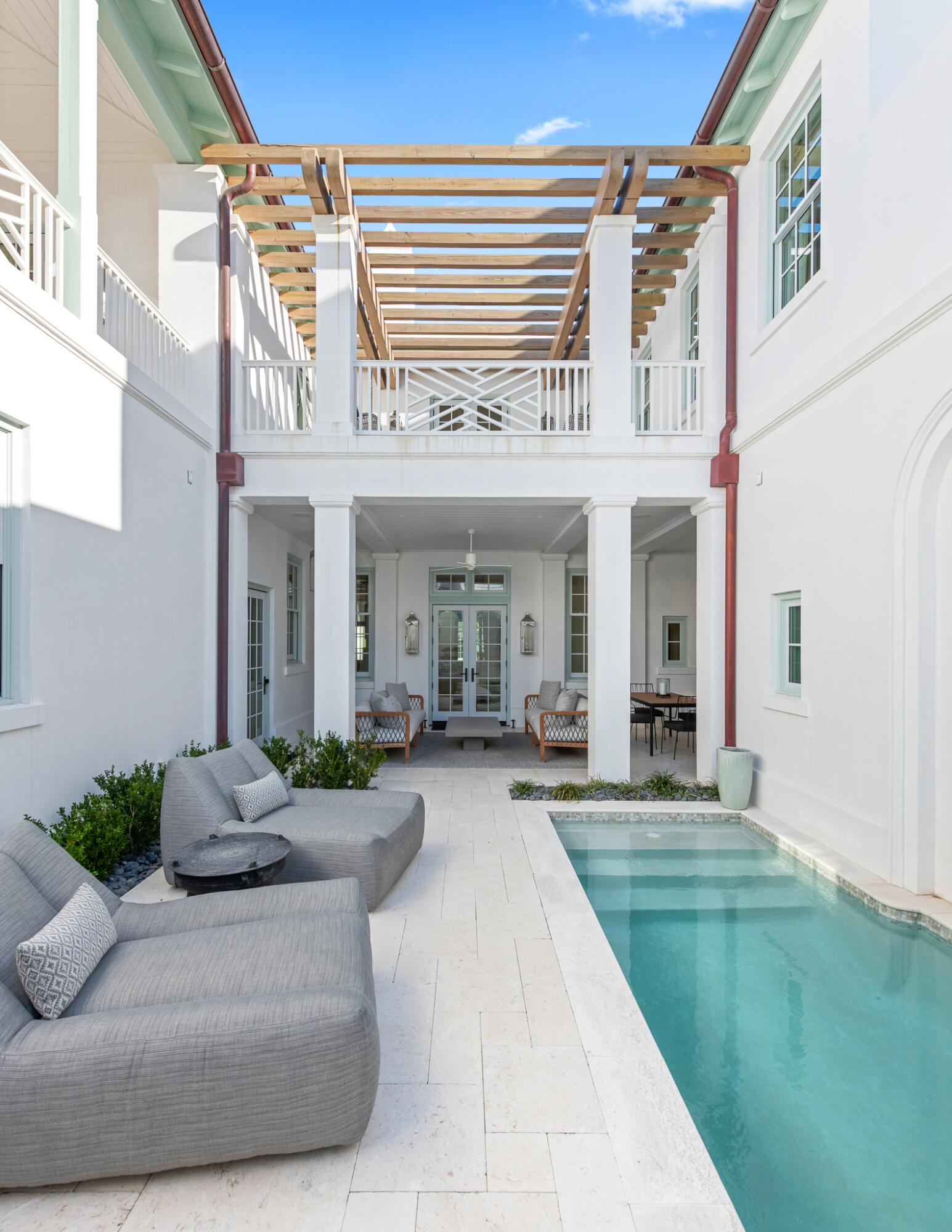 16 Smugglers Alley Inlet Beach, Unit BB6 Inlet Beach, FL 32461 - Photo 20 of 57 a view of a house with a fountain and a floor to ceiling window and potted plants