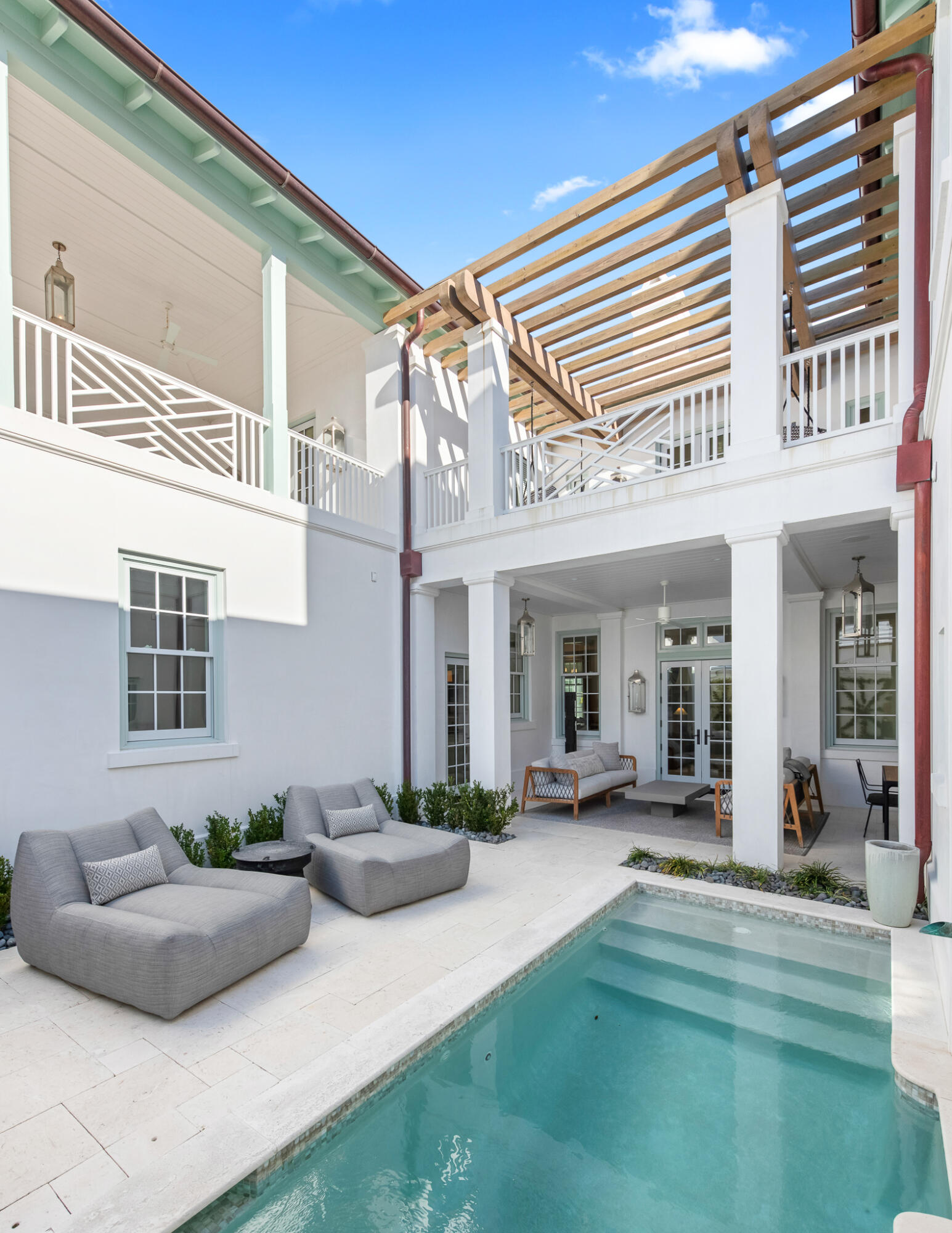 16 Smugglers Alley Inlet Beach, Unit BB6 Inlet Beach, FL 32461 - Photo 21 of 57 a view of a patio with couches chairs and potted plants