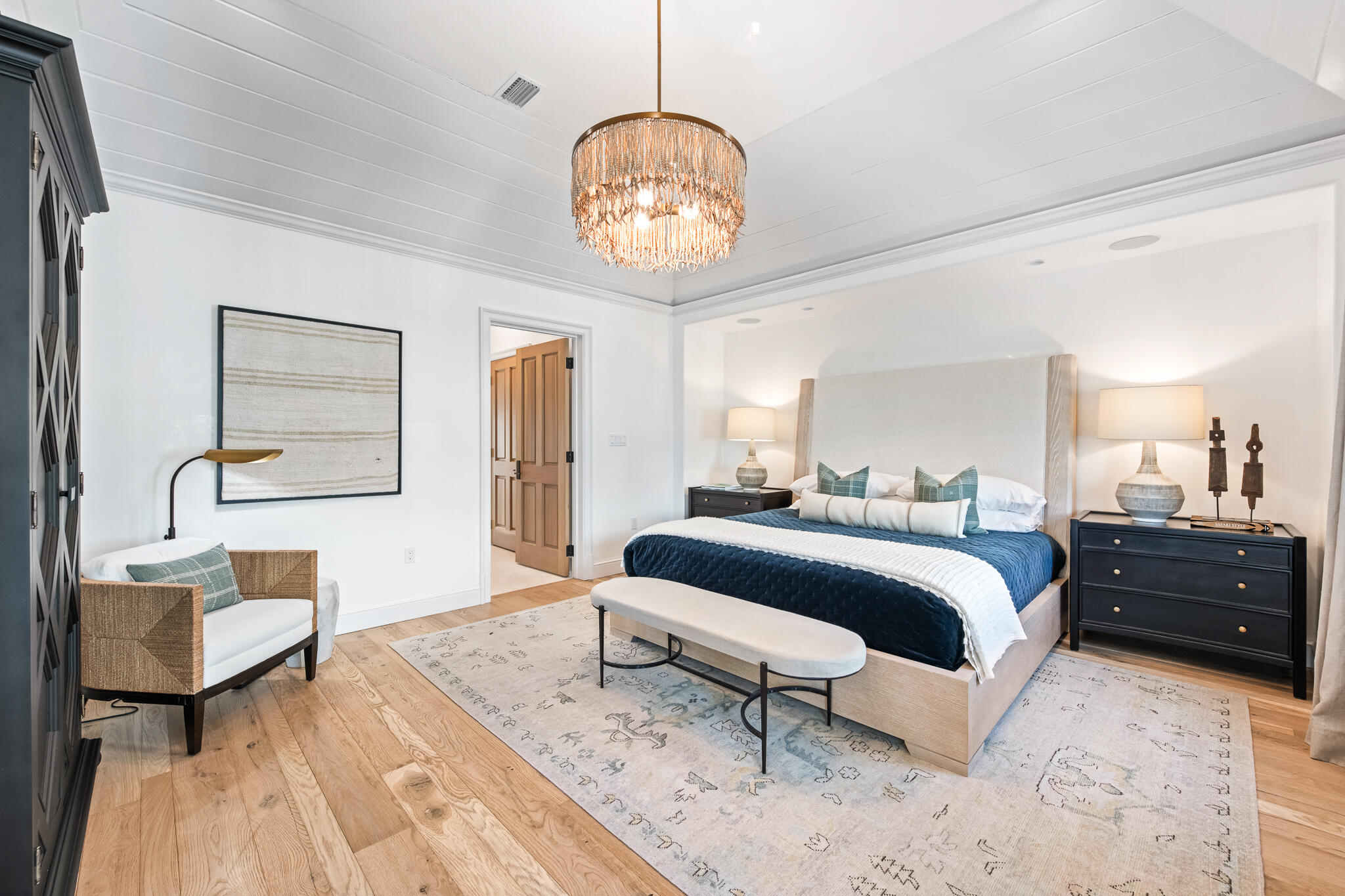 16 Smugglers Alley Inlet Beach, Unit BB6 Inlet Beach, FL 32461 - Photo 29 of 57 a bedroom with a bed and a chandelier