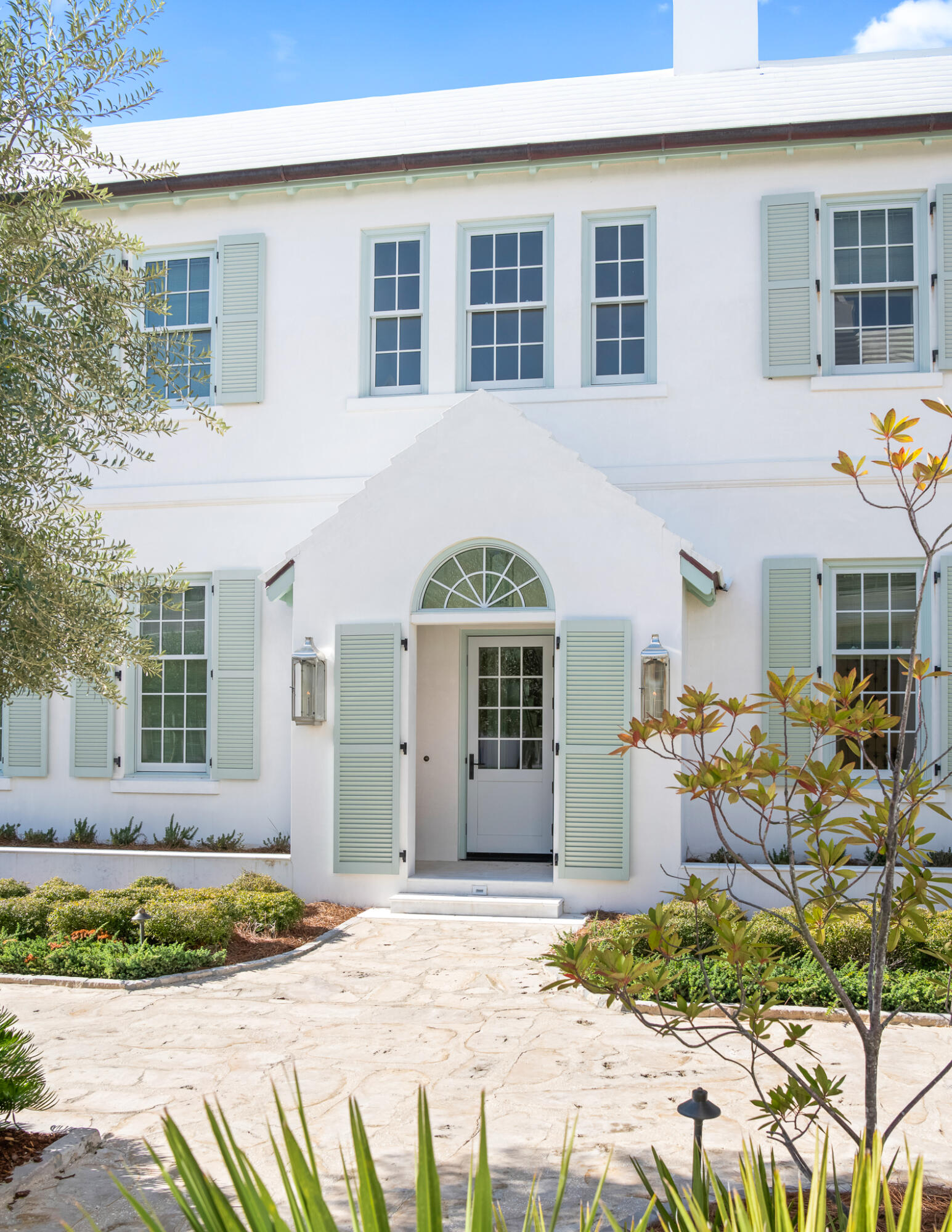16 Smugglers Alley Inlet Beach, Unit BB6 Inlet Beach, FL 32461 - Photo 5 of 57 a front view of a house with lots of glass windows and seating space