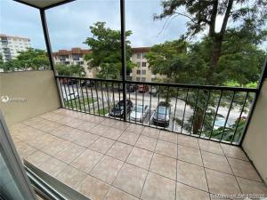 4166 Inverrary Drive, Unit 303 Lauderhill, FL 33319 - Photo 3 of 12 a balcony with trees in front of it