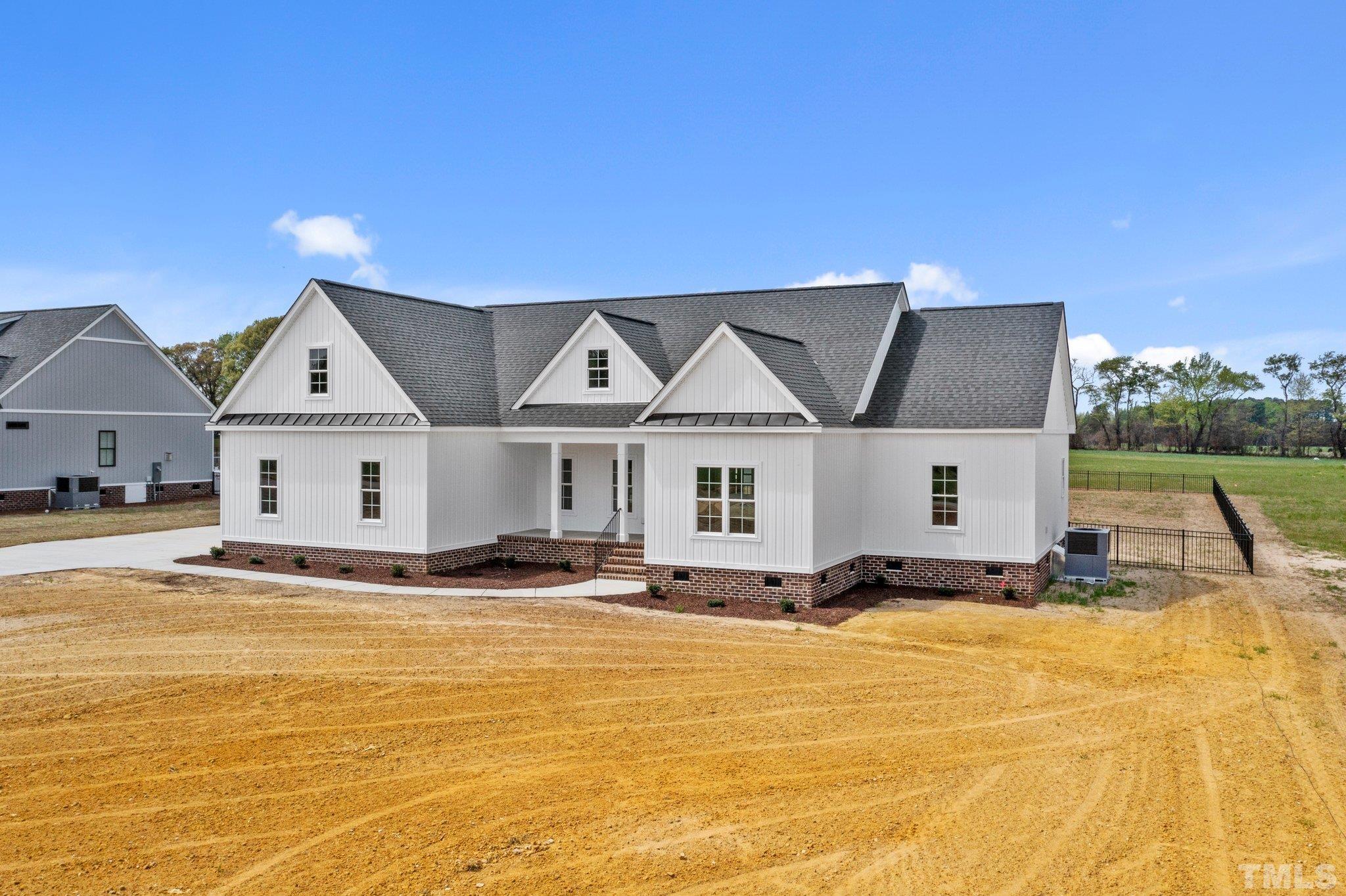 5748 Harvest Rdg Road Battleboro, NC 27809 - Photo 1 of 44 a front view of house with yard