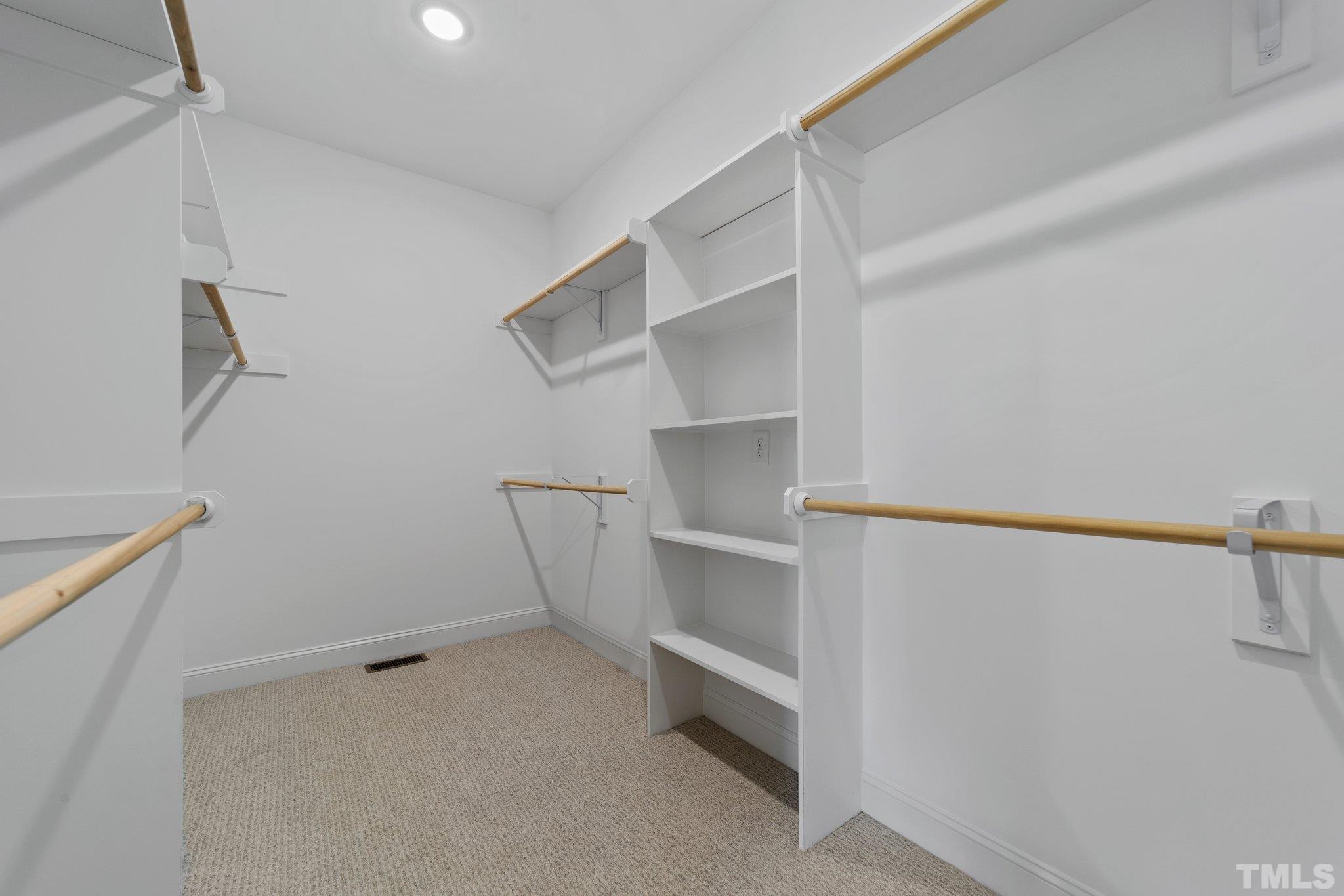 5748 Harvest Rdg Road Battleboro, NC 27809 - Photo 26 of 44 a view of walk in closet with empty racks