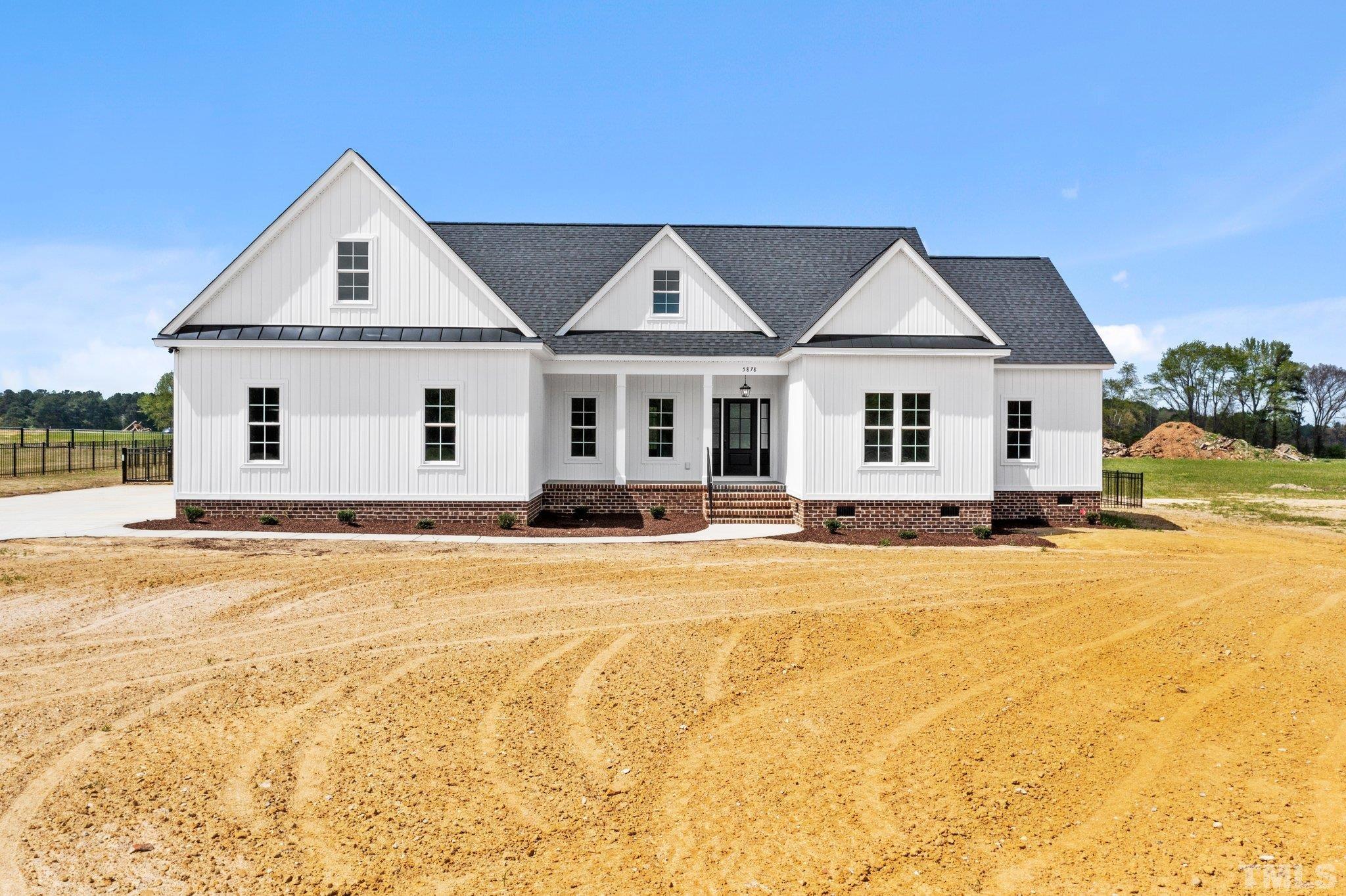 5748 Harvest Rdg Road Battleboro, NC 27809 - Photo 3 of 44 a front view of a house with a yard