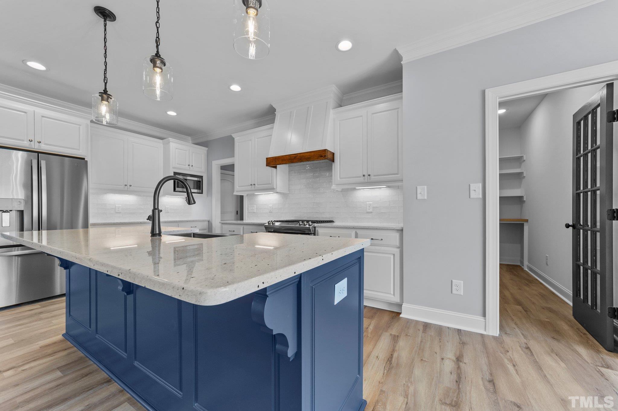 5748 Harvest Rdg Road Battleboro, NC 27809 - Photo 33 of 44 a kitchen with stainless steel appliances granite countertop a sink and a refrigerator