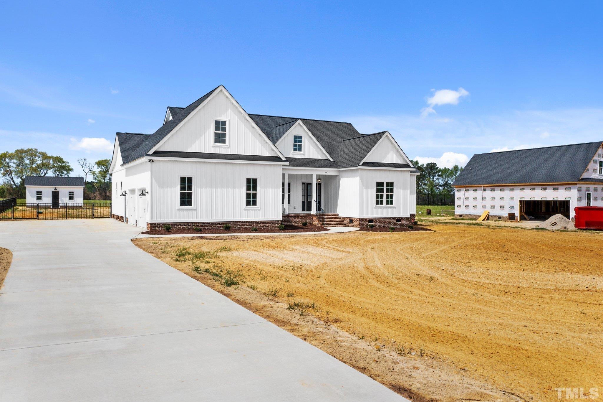 5748 Harvest Rdg Road Battleboro, NC 27809 - Photo 5 of 44 a front view of a house with a yard