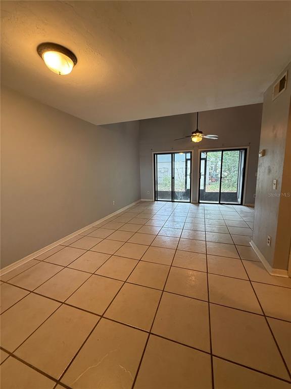 7200 Southwest 8th Avenue, Unit T128 Gainesville, FL 32607 - Photo 7 of 38 a view of an empty room with a window