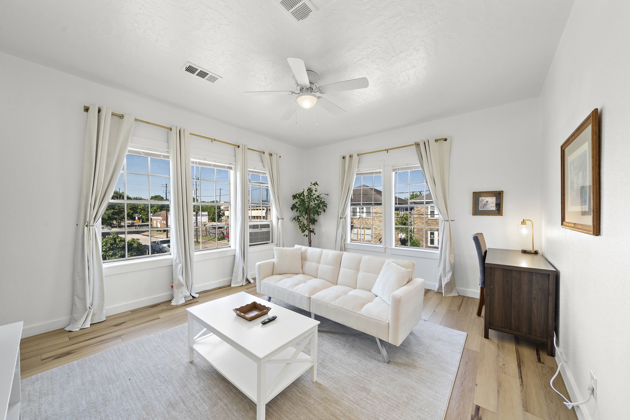 3901 Dallas Street, Unit D Houston, TX 77023 - Photo 4 of 35 a living room with furniture and a large window