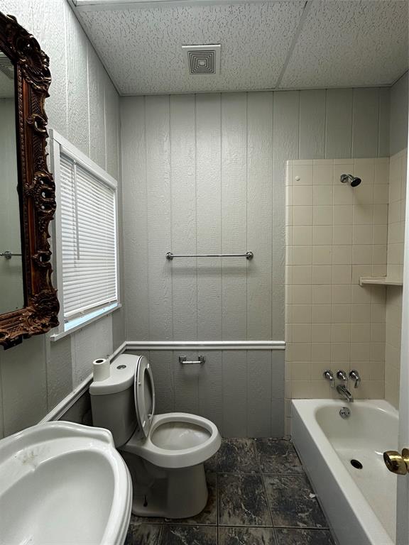 903 West 30th Street, Unit B Austin, TX 78705 - Photo 3 of 9 Bathroom with shower / bath combination and a drop ceiling