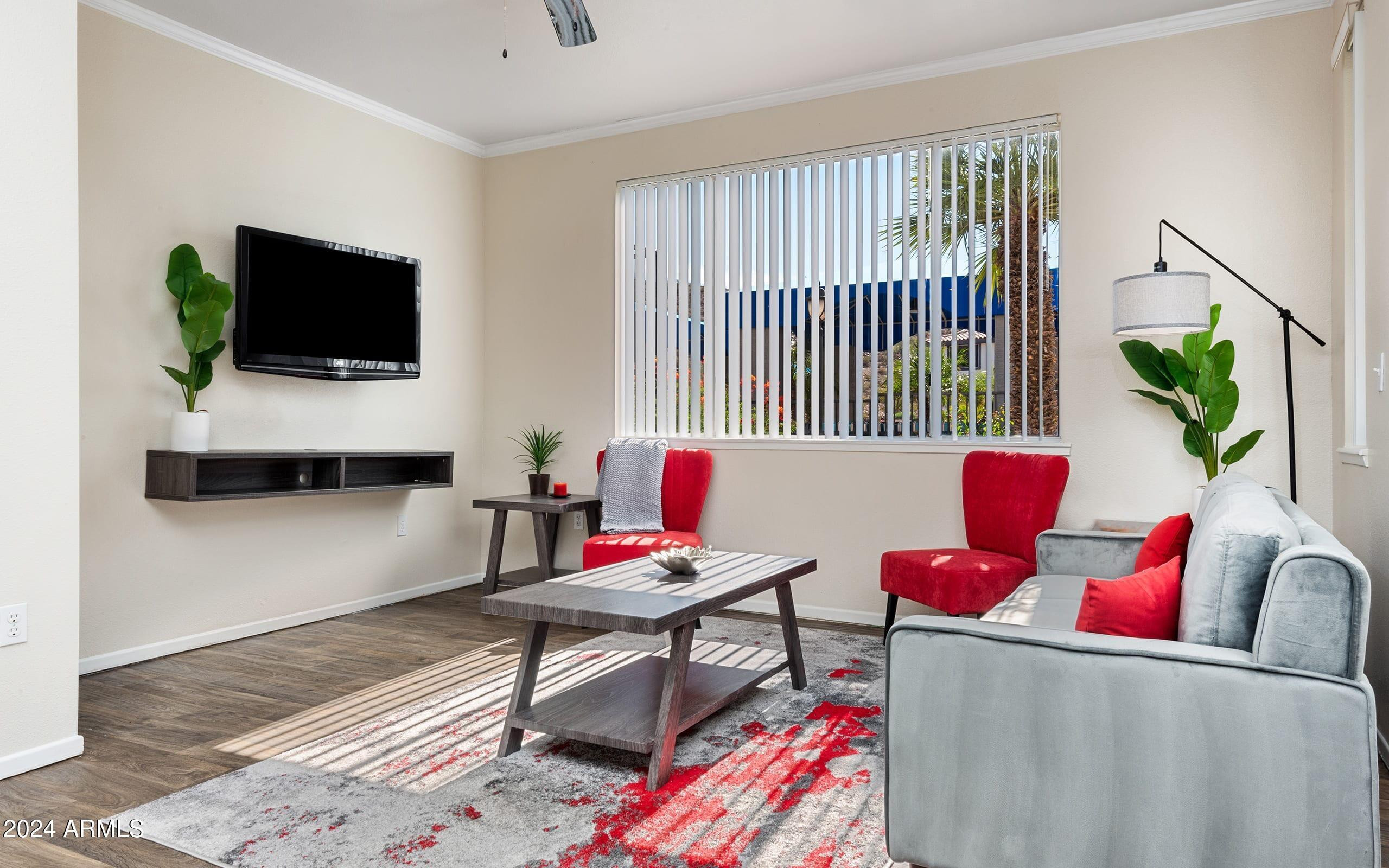 3625 East Ray Road, Unit 3 Phoenix, AZ 85044 - Photo 2 of 30 a living room with furniture and a flat screen tv