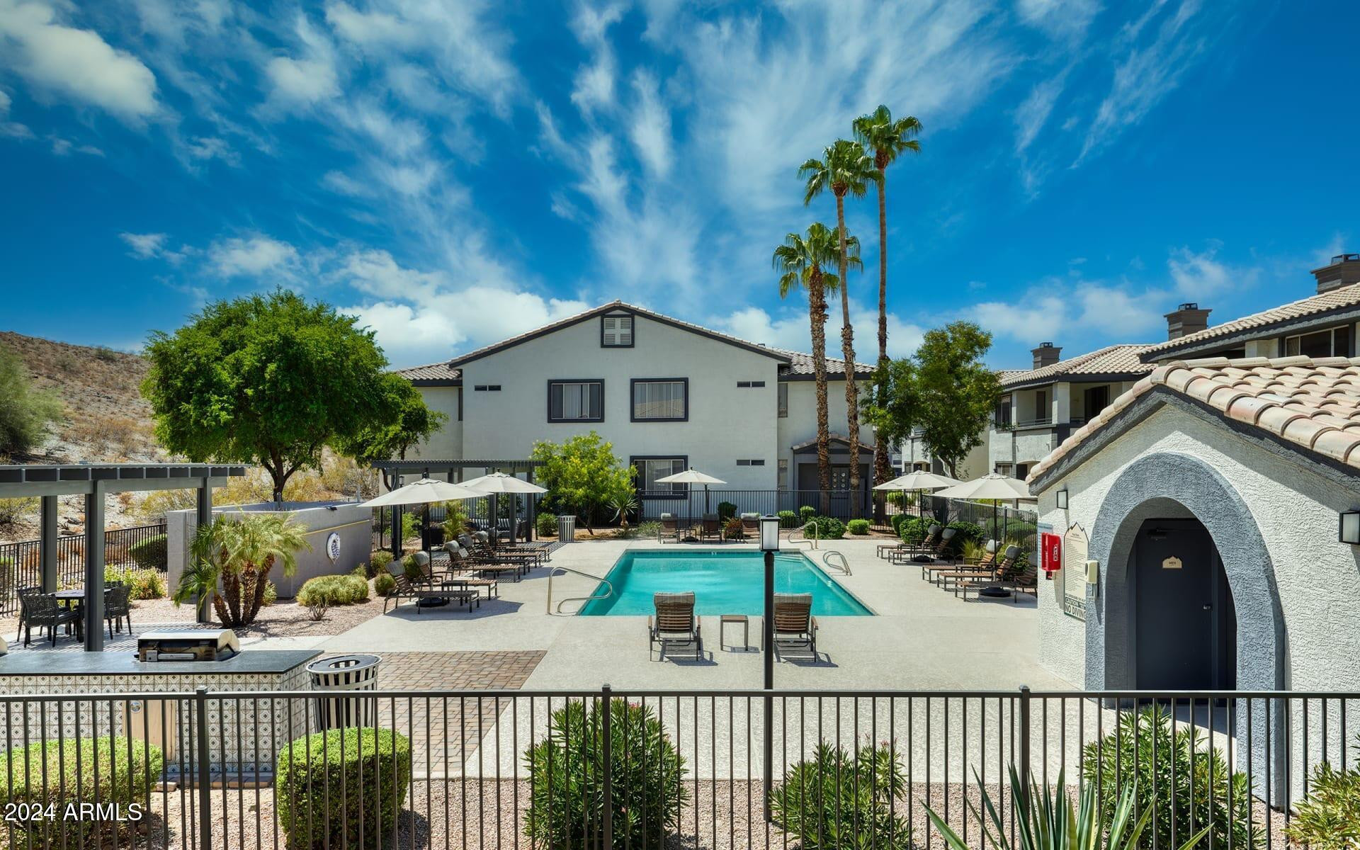 3625 East Ray Road, Unit 3 Phoenix, AZ 85044 - Photo 29 of 30 a view of a house with a porch and furniture