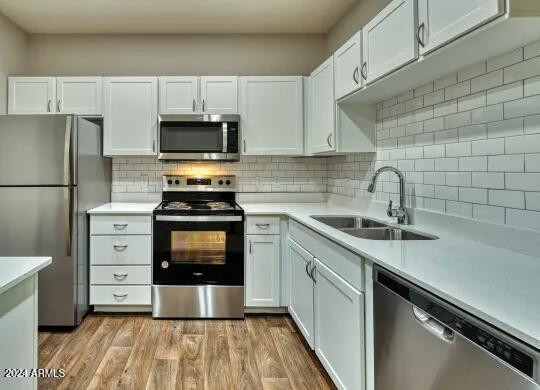 3625 East Ray Road, Unit 3 Phoenix, AZ 85044 - Photo 6 of 30 a kitchen with appliances a sink and cabinets