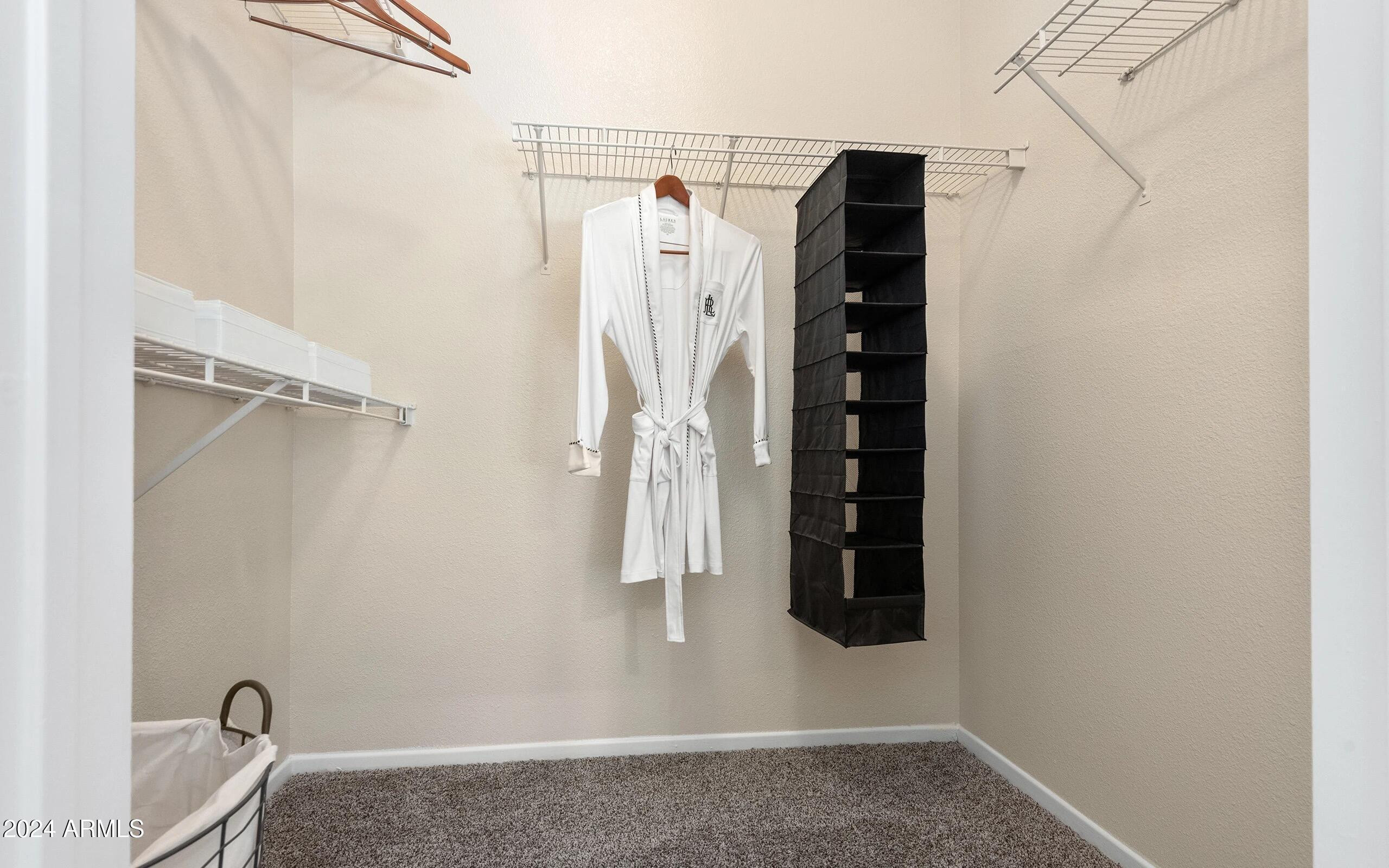 3625 East Ray Road, Unit 3 Phoenix, AZ 85044 - Photo 8 of 30 a view of walk in closet with clothes and shoes