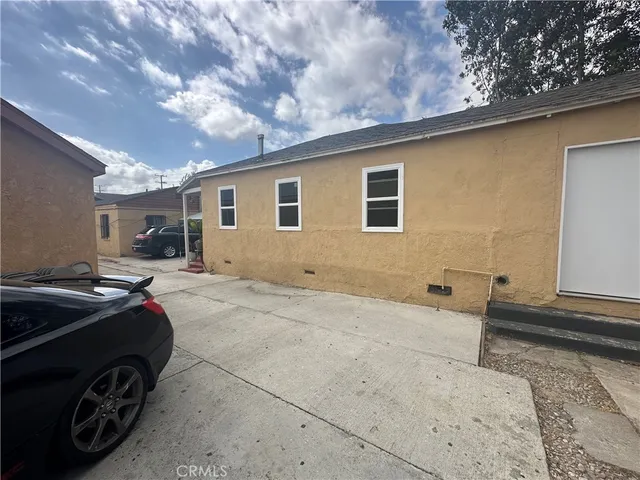 a kitchen with sink stove and cabinets
