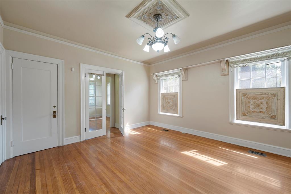 2228 Parrott Avenue Waco, TX 76707 - Photo 15 of 23 a view of an empty room with wooden floor and a window