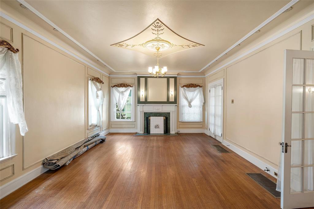 2228 Parrott Avenue Waco, TX 76707 - Photo 3 of 23 wooden floor in an empty room with a window