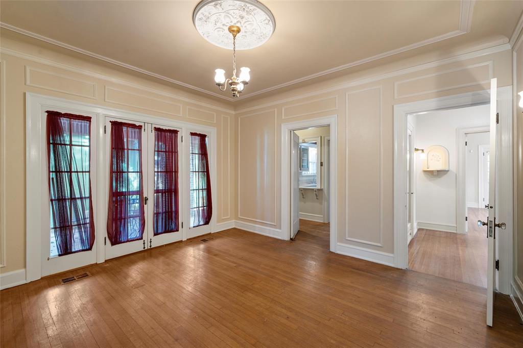 2228 Parrott Avenue Waco, TX 76707 - Photo 6 of 23 wooden floor in an empty room with a window