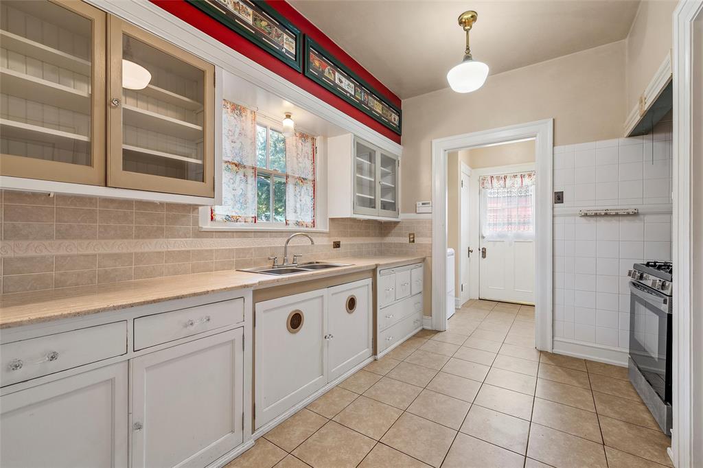 2228 Parrott Avenue Waco, TX 76707 - Photo 8 of 23 a large kitchen with a sink and cabinets